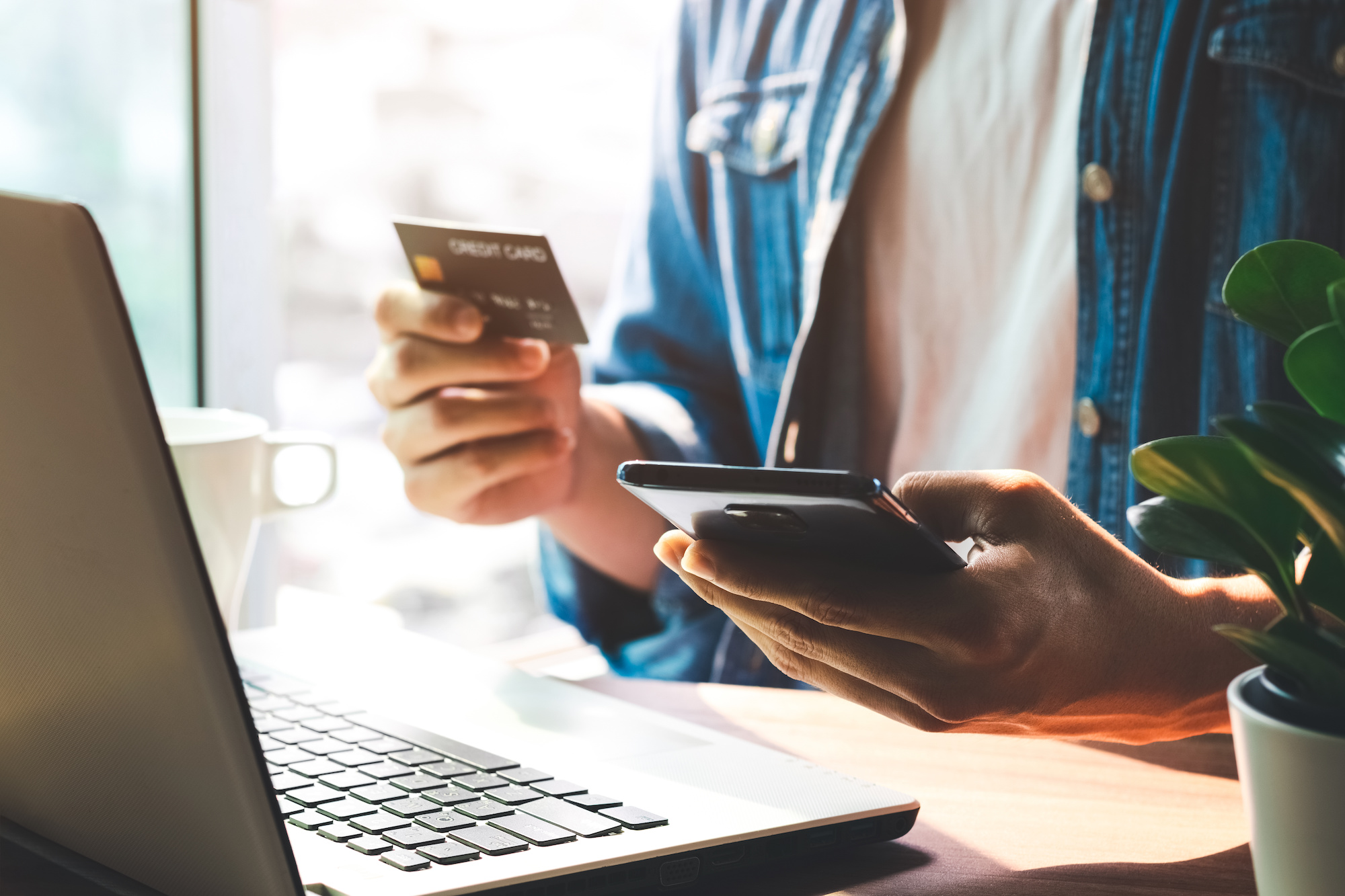 Men use their credit cards through mobile internet banking apps to shop online and digital payment ideas